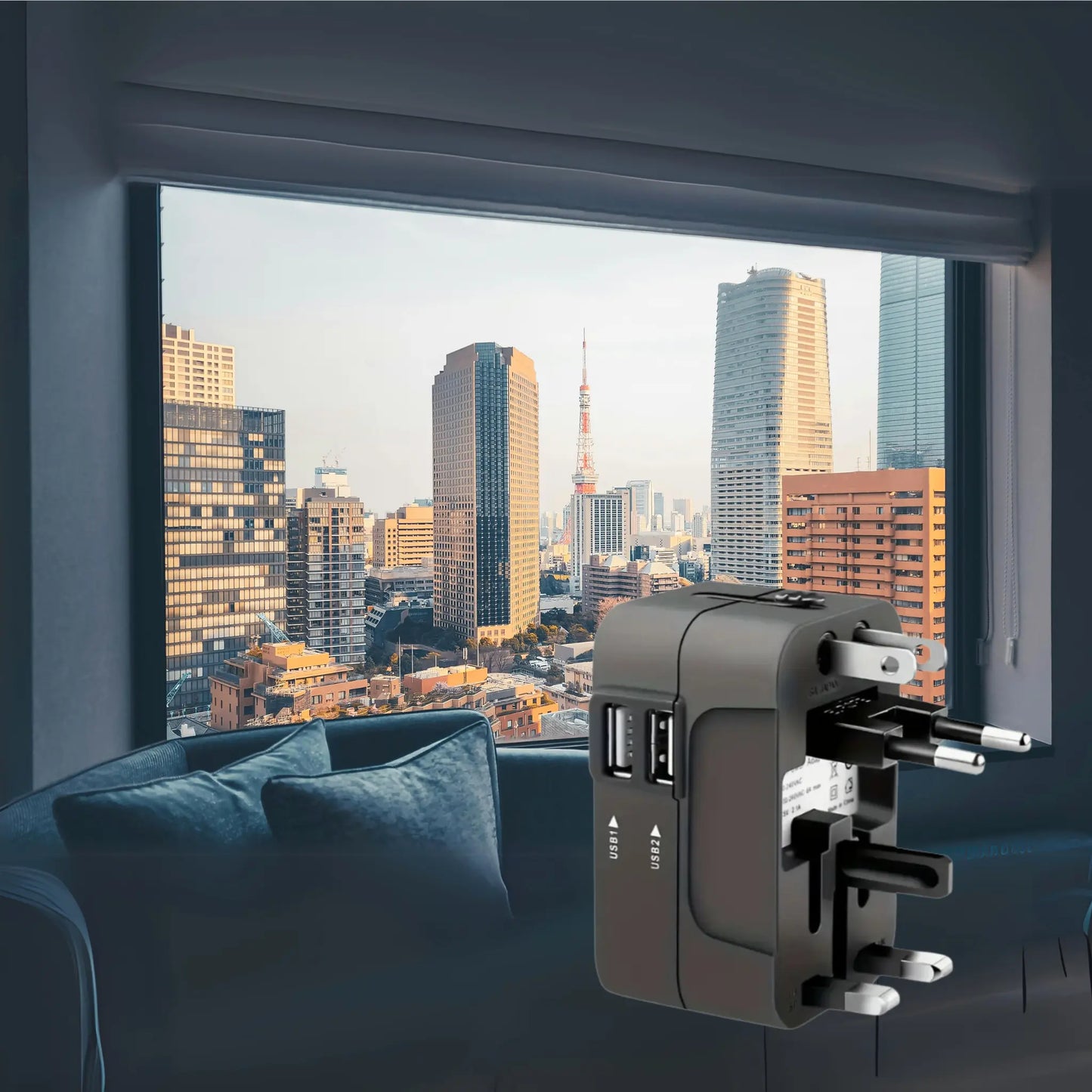 AdaptGo world adapter displayed in a city view, enabling global device charging in over 150 countries.