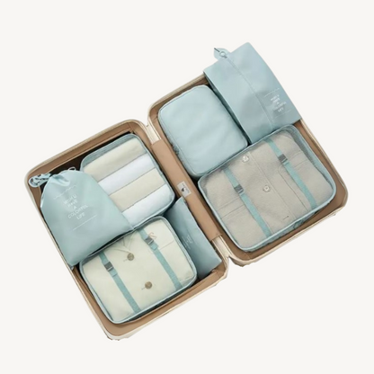 Travel Cocoon 7-delige reisorganizer set met opbergzakken in pastelkleuren voor efficiënte bagageorganisatie.